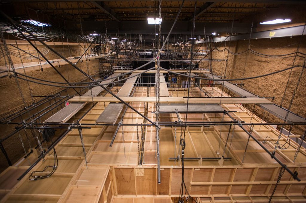 North Stage at Annex 302 seen from the lighting grid, with a set under construction below