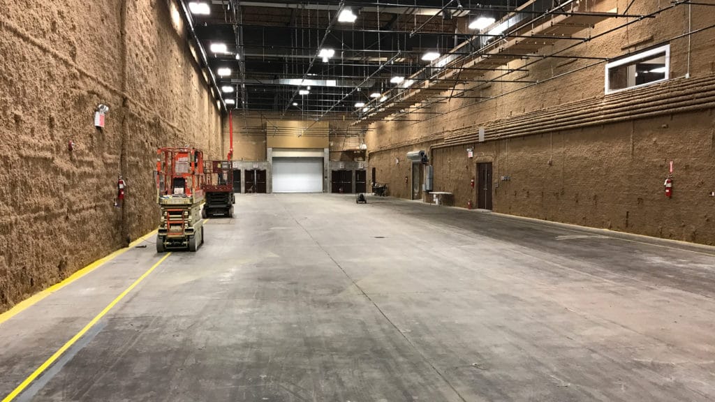 North Stage at Annex 302 in Brooklyn showing the truck drive-in loading door and overhead lighting grid