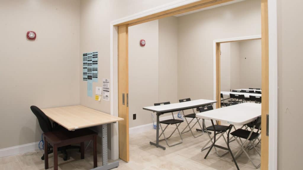 Flex space at Annex 302 set up as a production office with tables and chairs