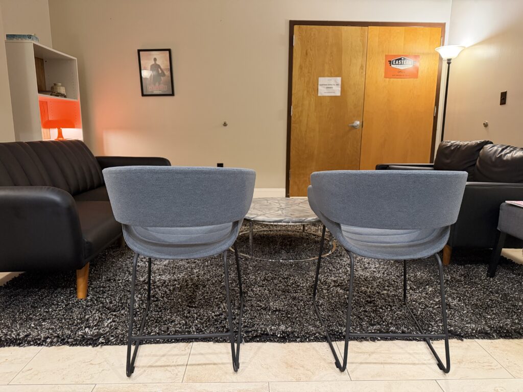 Client lounge at Annex 302 with lounge seating and a marble coffee table